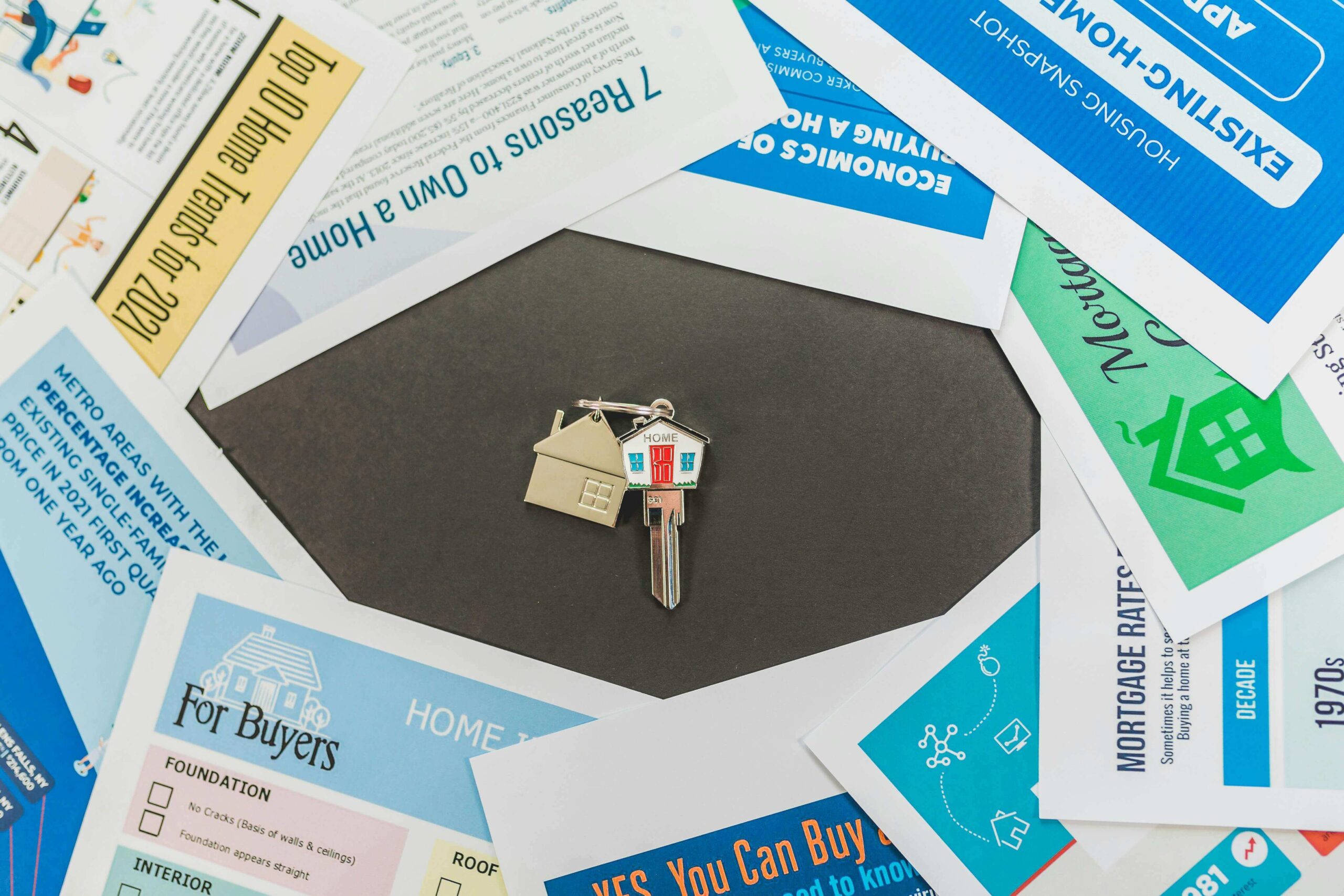 house key with paper leaflets on a table